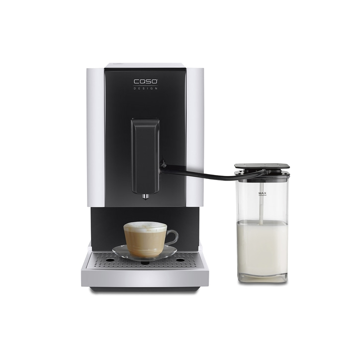 Coffee machine with milk container and cappuccino cup on a saucer