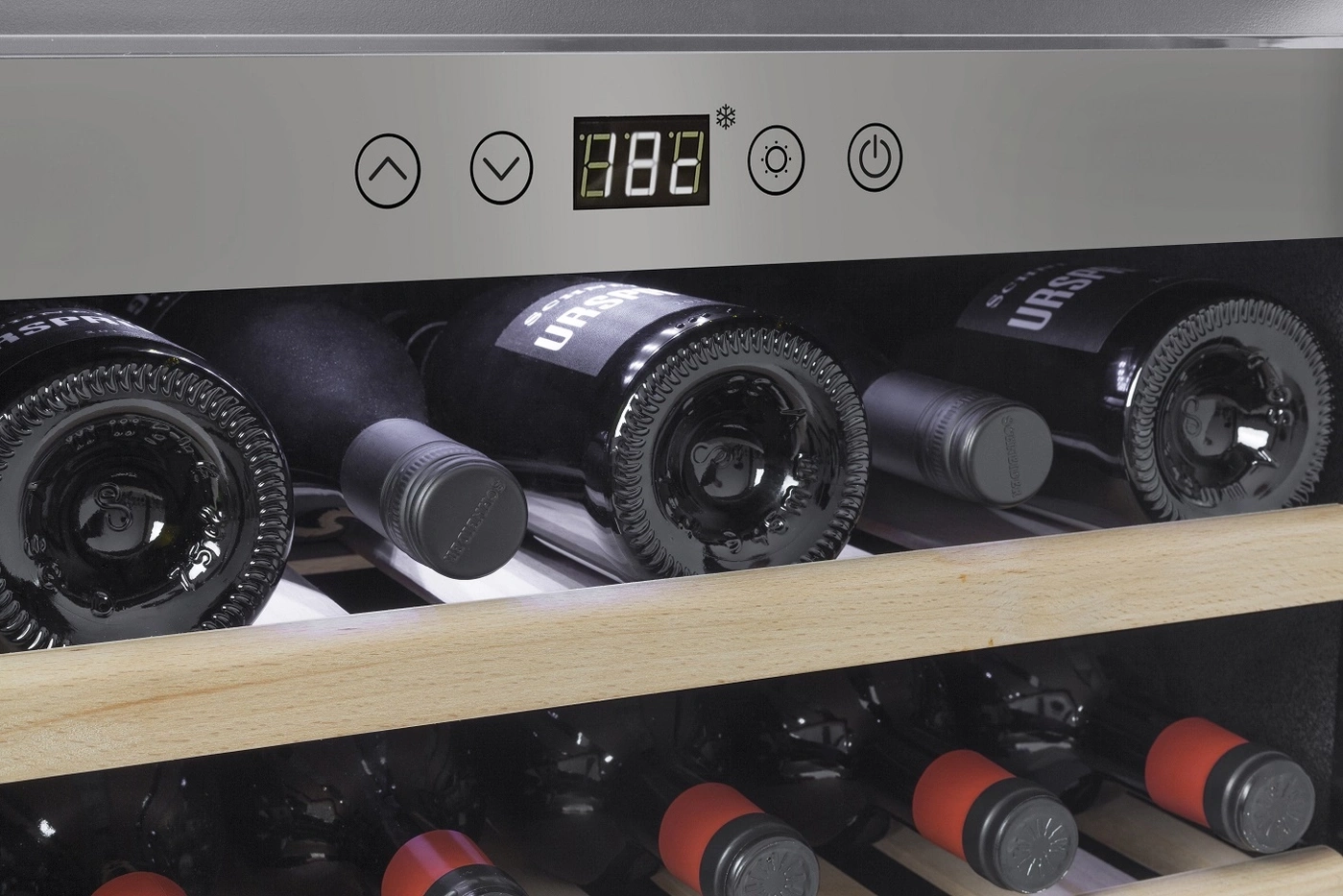 Wine cooler with temperature display and wine bottles on the shelves.