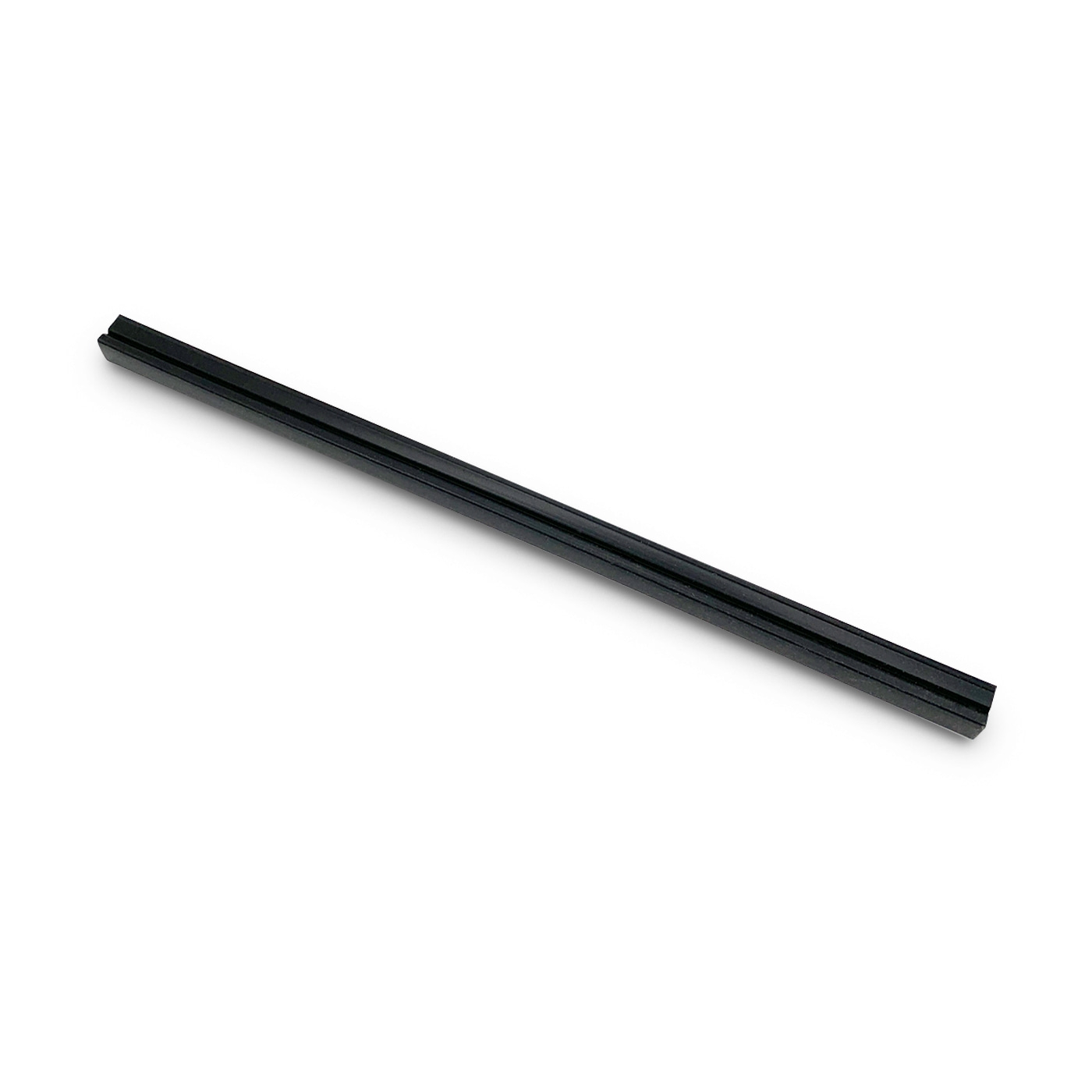 Black, elongated object on white background. Looks like a ruler or a similar item.