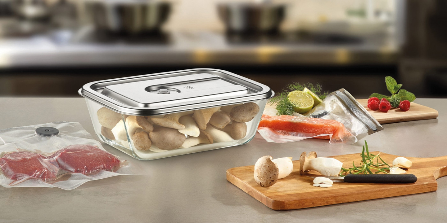 Food, vacuum packaging, vegetables, meat, fish, herbs, wooden board, kitchen