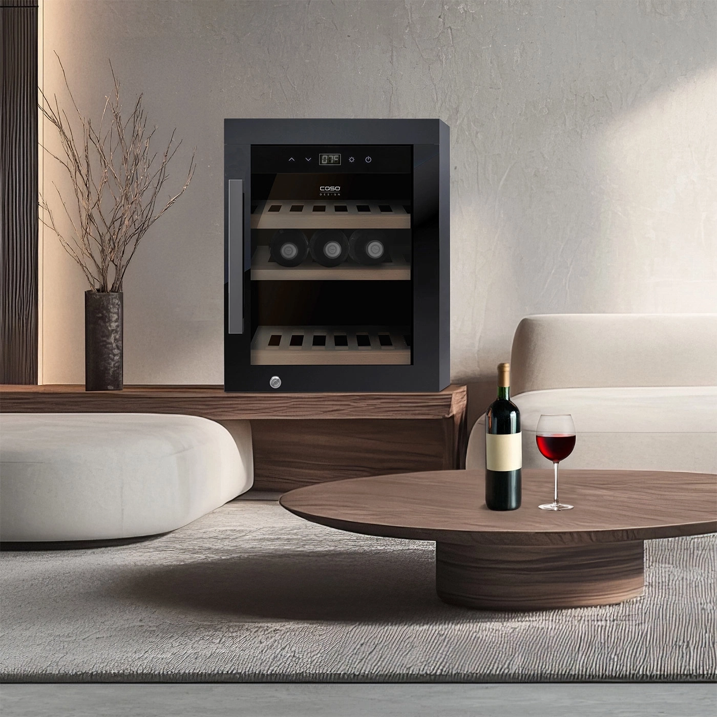 A modern wine cooler with wine and glass on a coffee table.