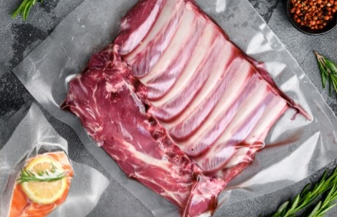 Raw meat on paper, with herbs and spices, close-up shot
