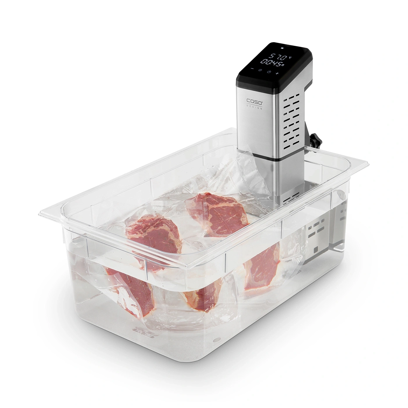 Sous vide machine with meat pieces in water bath, ready for cooking process.