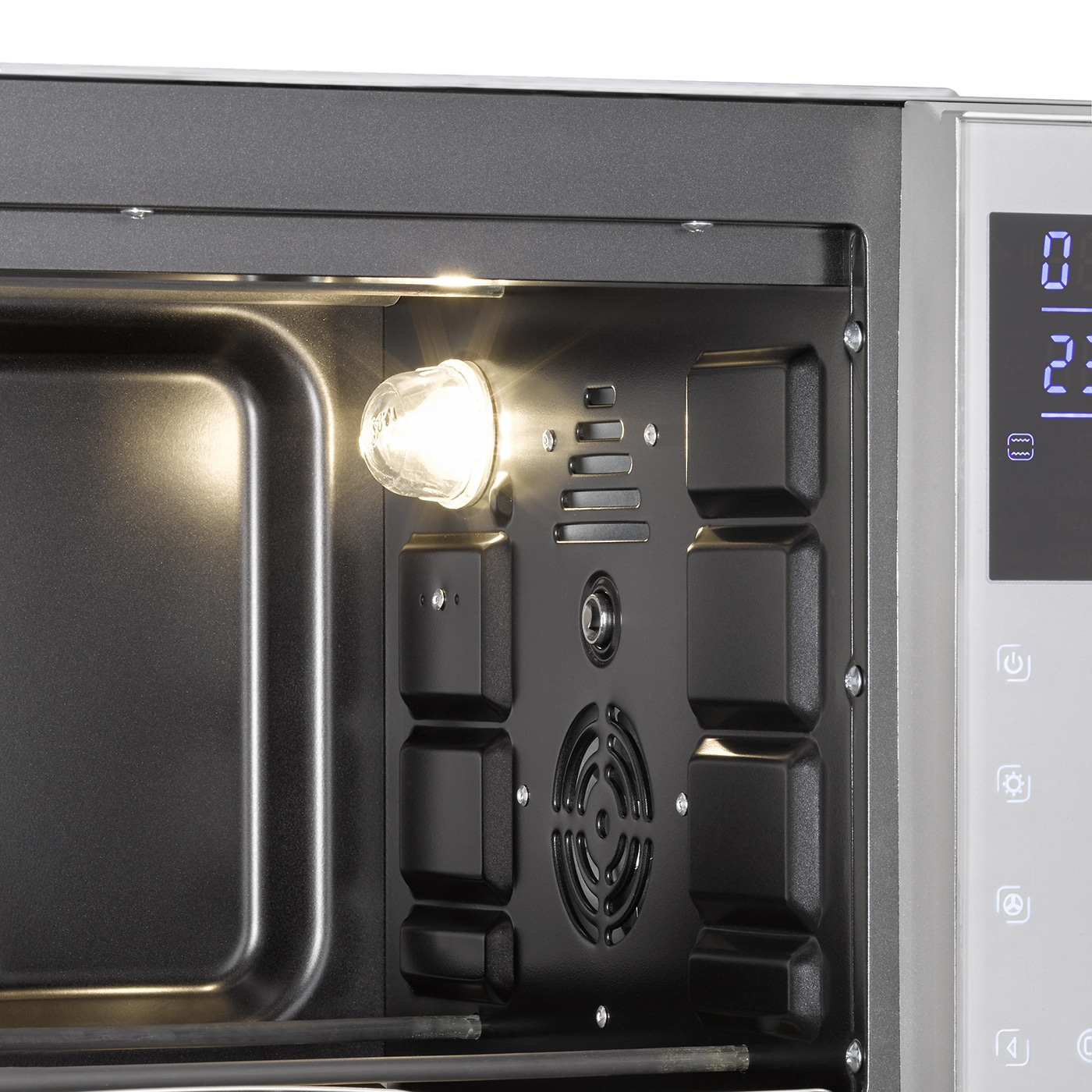 Close-up of a microwave oven with interior light and control panel