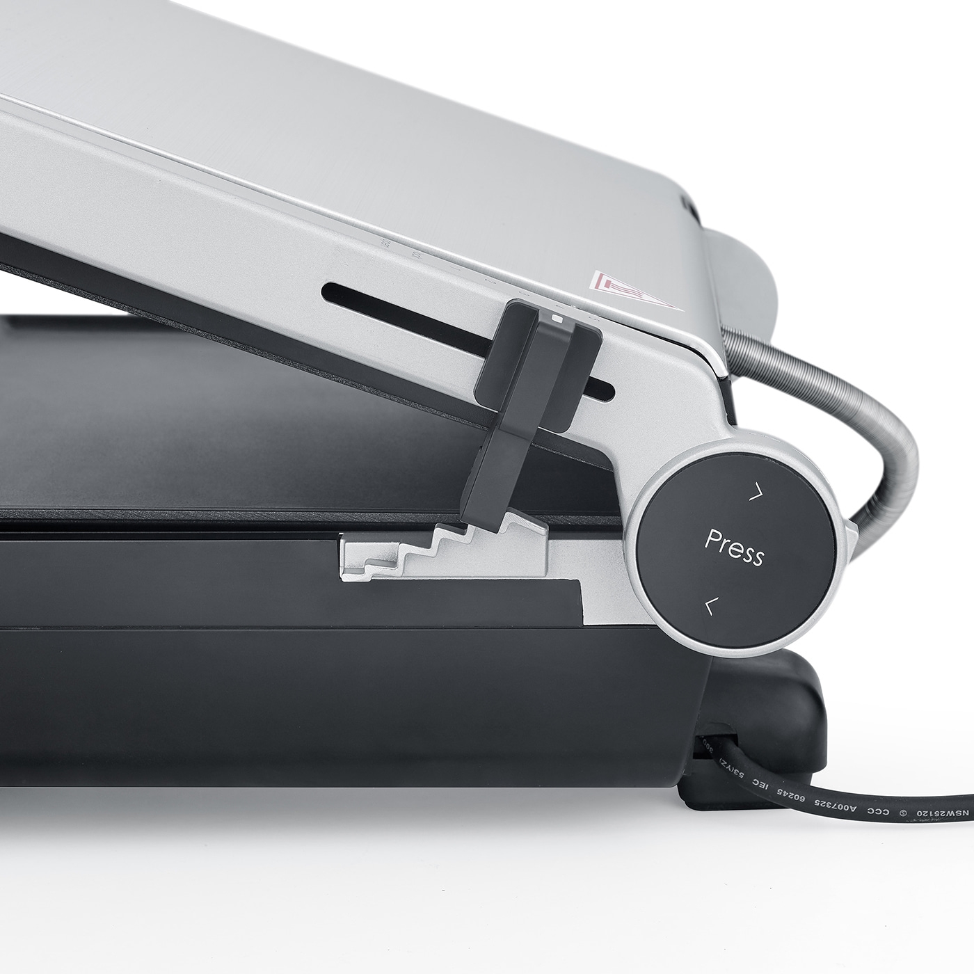 Close-up of a gray toaster with a black button and cable, press to use