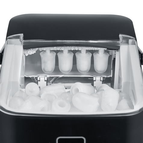 Ice maker with ice cubes and ice inside, close-up shot of the machine