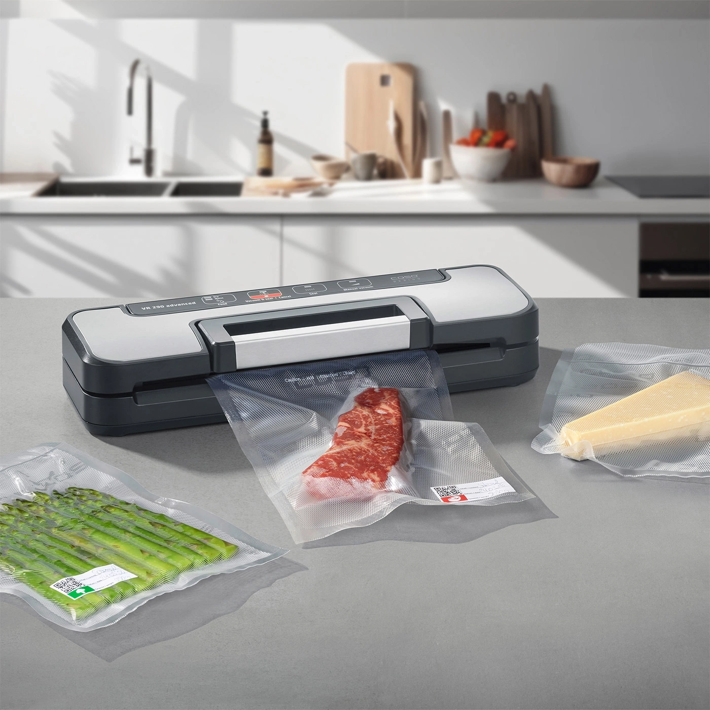 A vacuum sealer machine seals food items like meat, asparagus, and cheese in plastic bags.