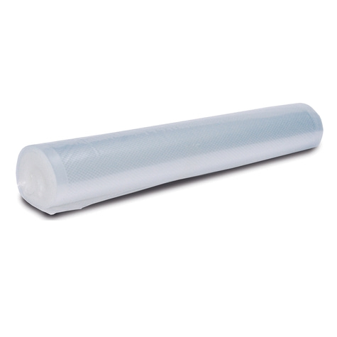 Roll of transparent plastic lying on a white background, close up.