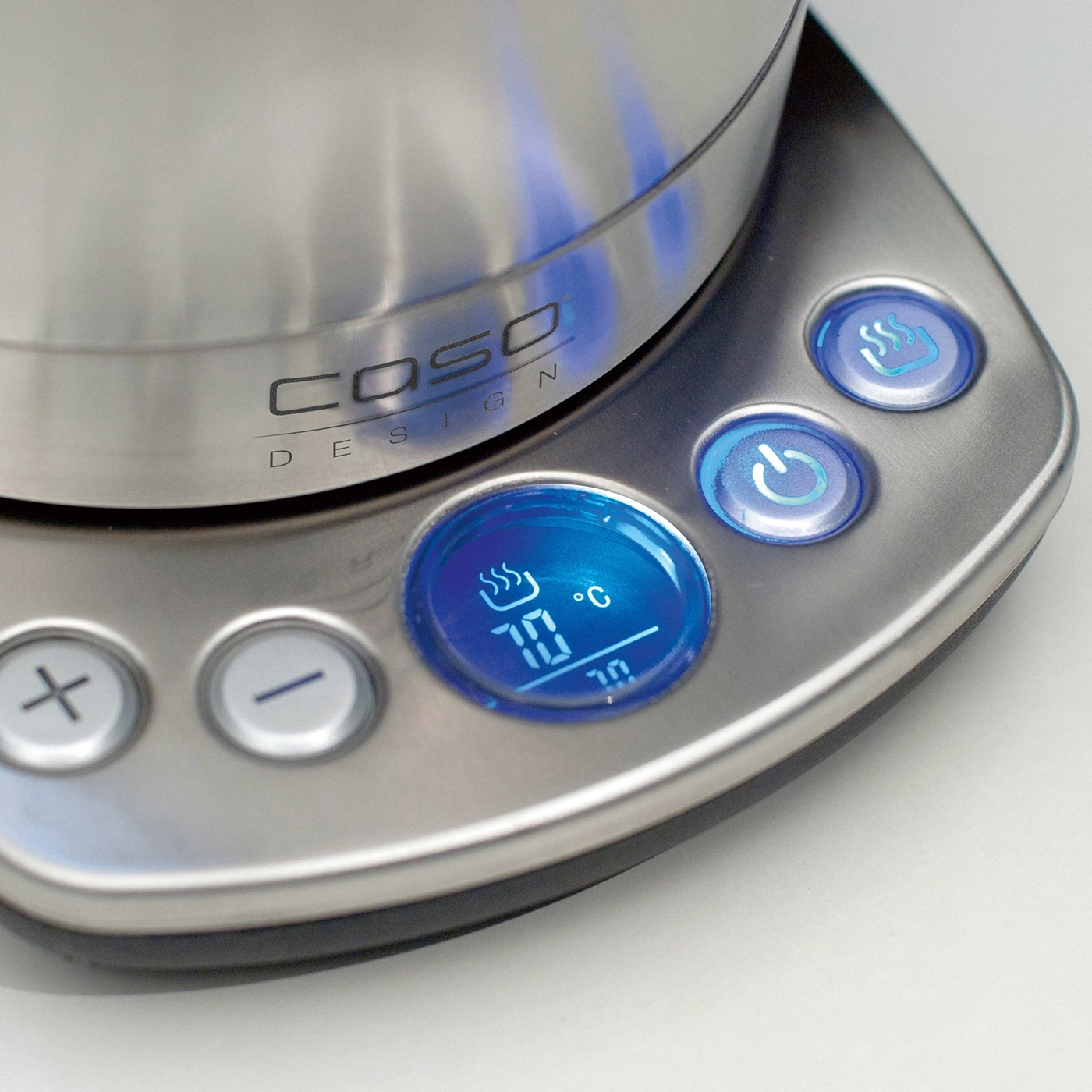 Close-up of a kettle with blue lighting, temperature display, and control buttons.