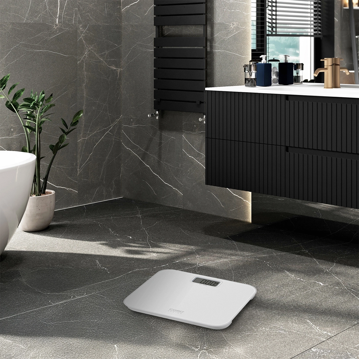 Bathroom with scale, sink, plants, and black wall