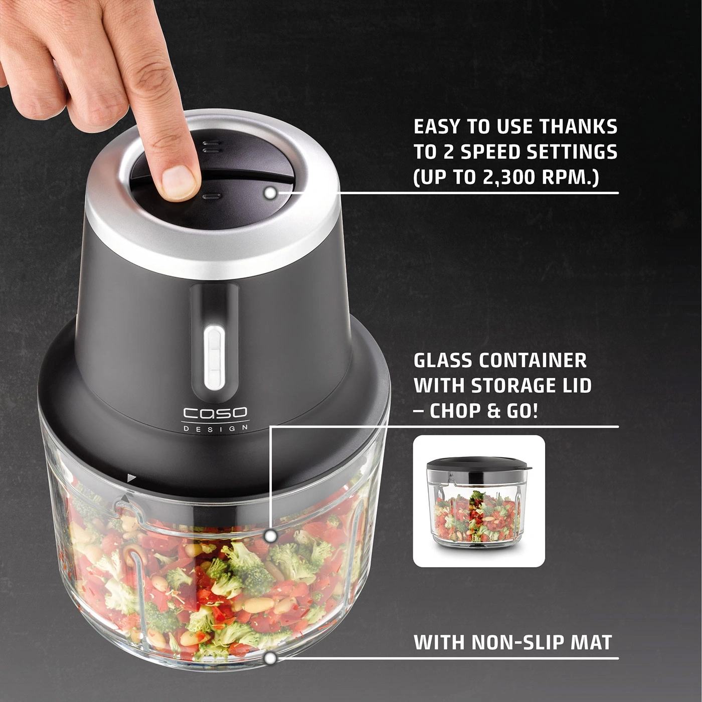 A finger presses the button of a food chopper with a glass container.