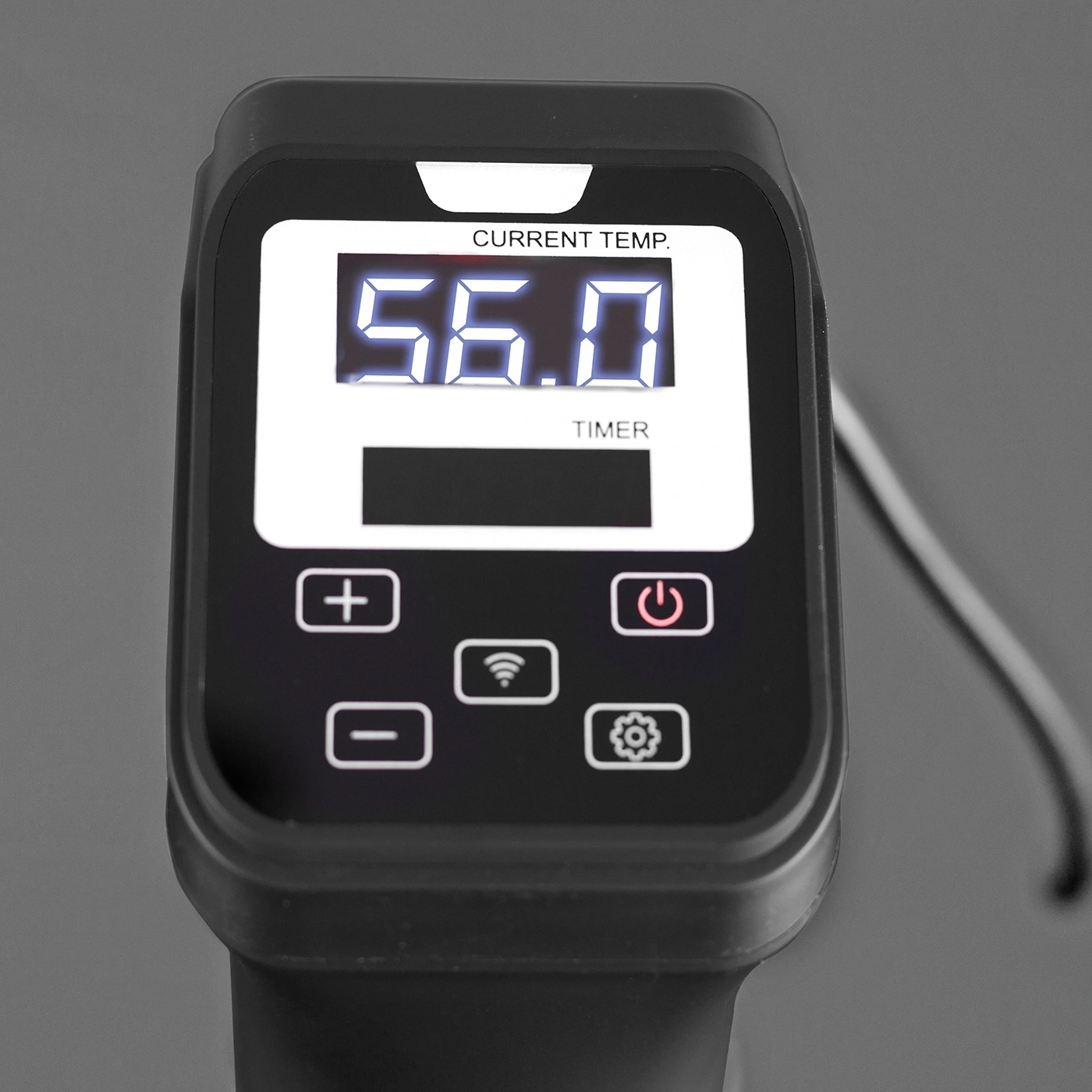 Digital thermometer displaying 56.0 degrees Celsius with control buttons and timer.