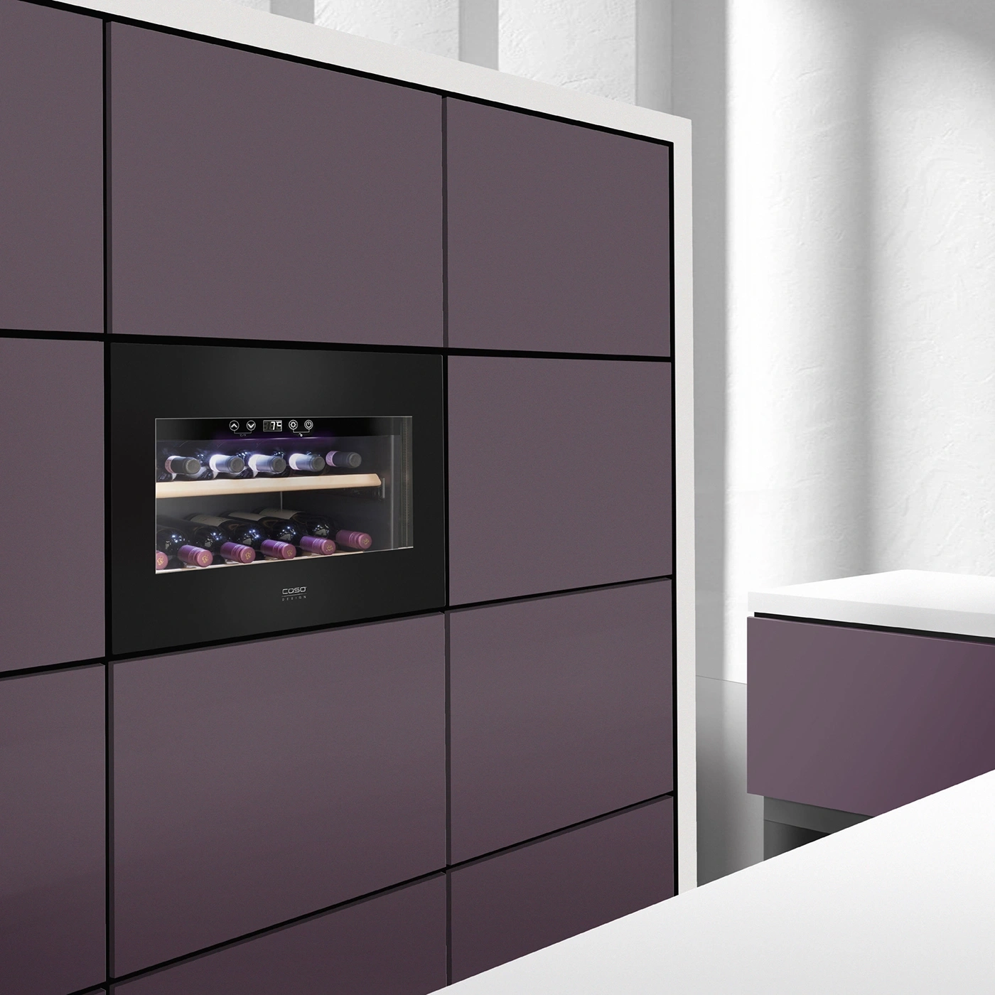 Wine cooler in modern kitchen with dark cabinets and wine bottles