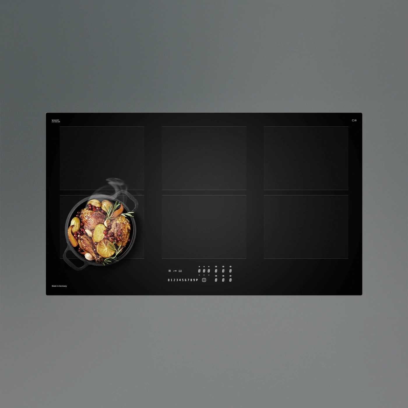 A modern induction cooktop featuring food preparation and controls.