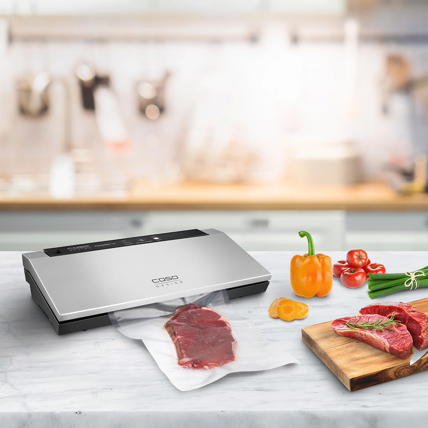 Vacuum sealer with meat and vegetables on a kitchen countertop
