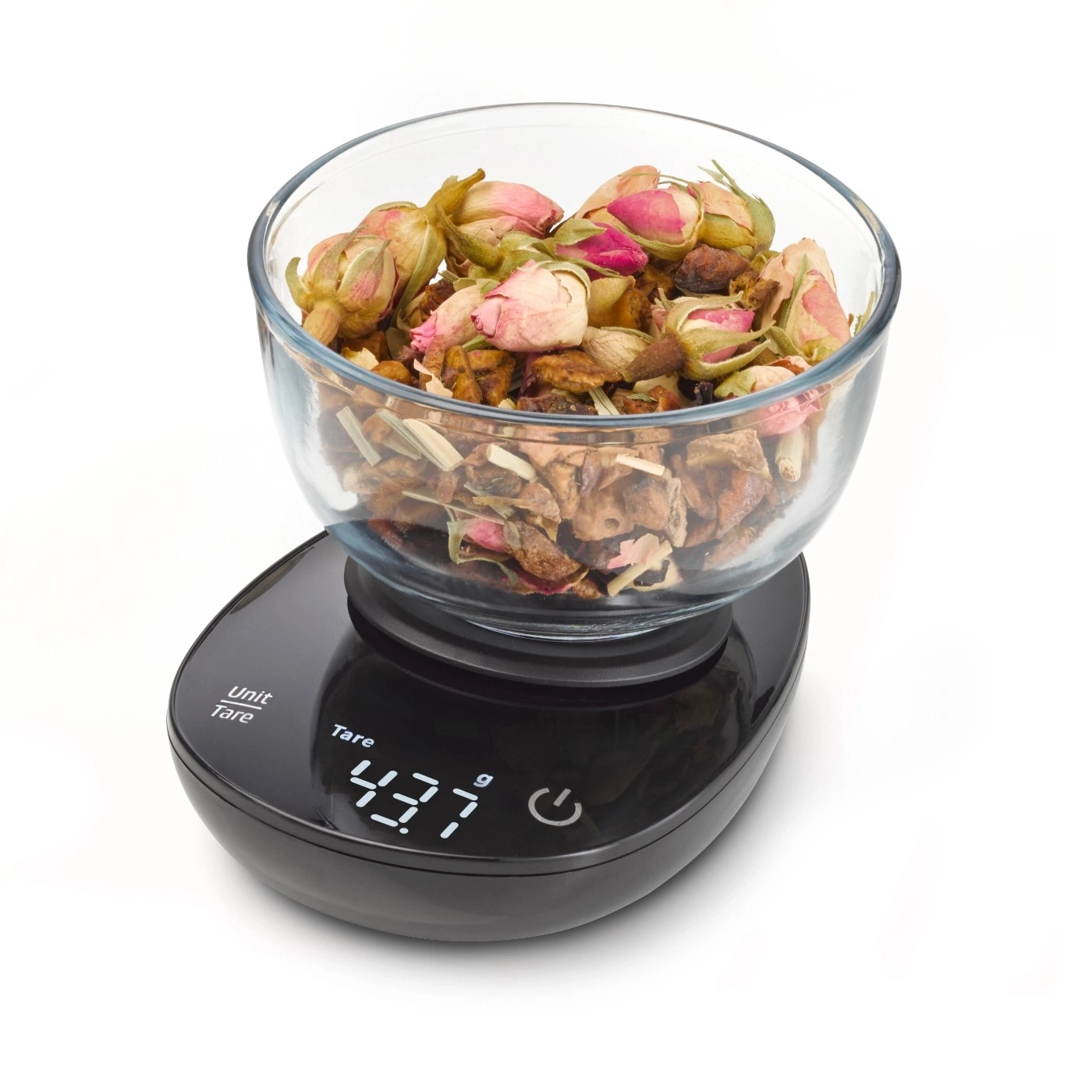 A scale with a glass bowl full of herbs, weighing 43.7 grams. 