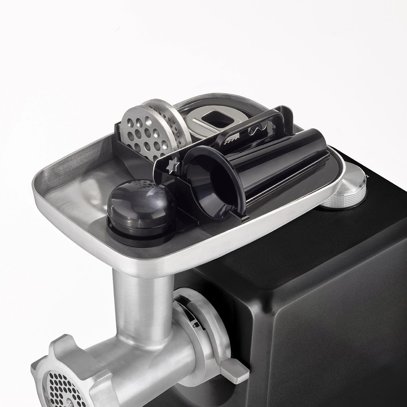 Meat grinder with accessories on white background, close-up, stainless steel