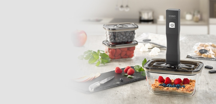 Food in containers with vacuum sealer on the table