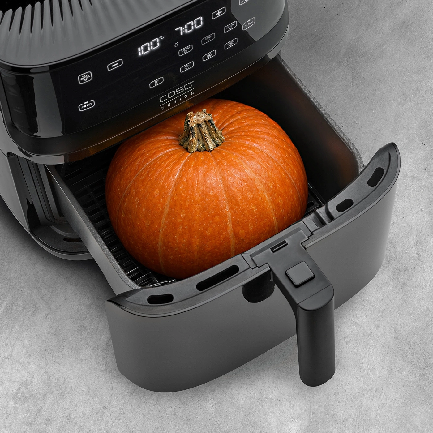 Pumpkin in an air fryer with digital display