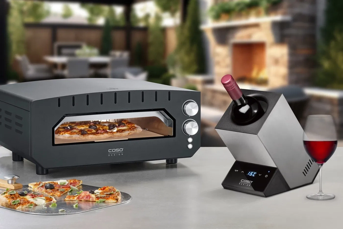 Pizza oven with wine holder and glass, outdoor dining setting