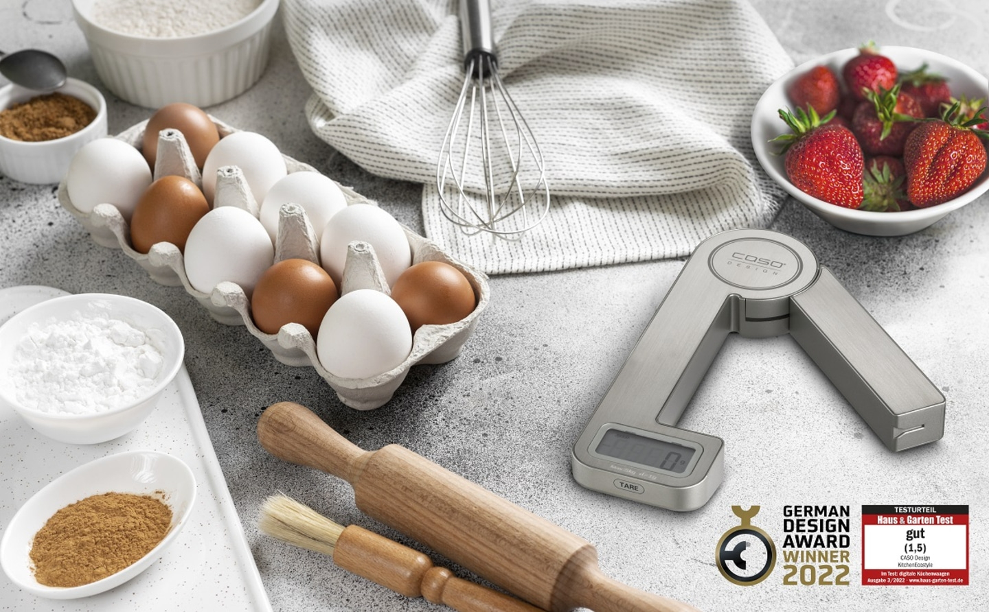 Baking ingredients with scale, eggs, flour, strawberries and awards