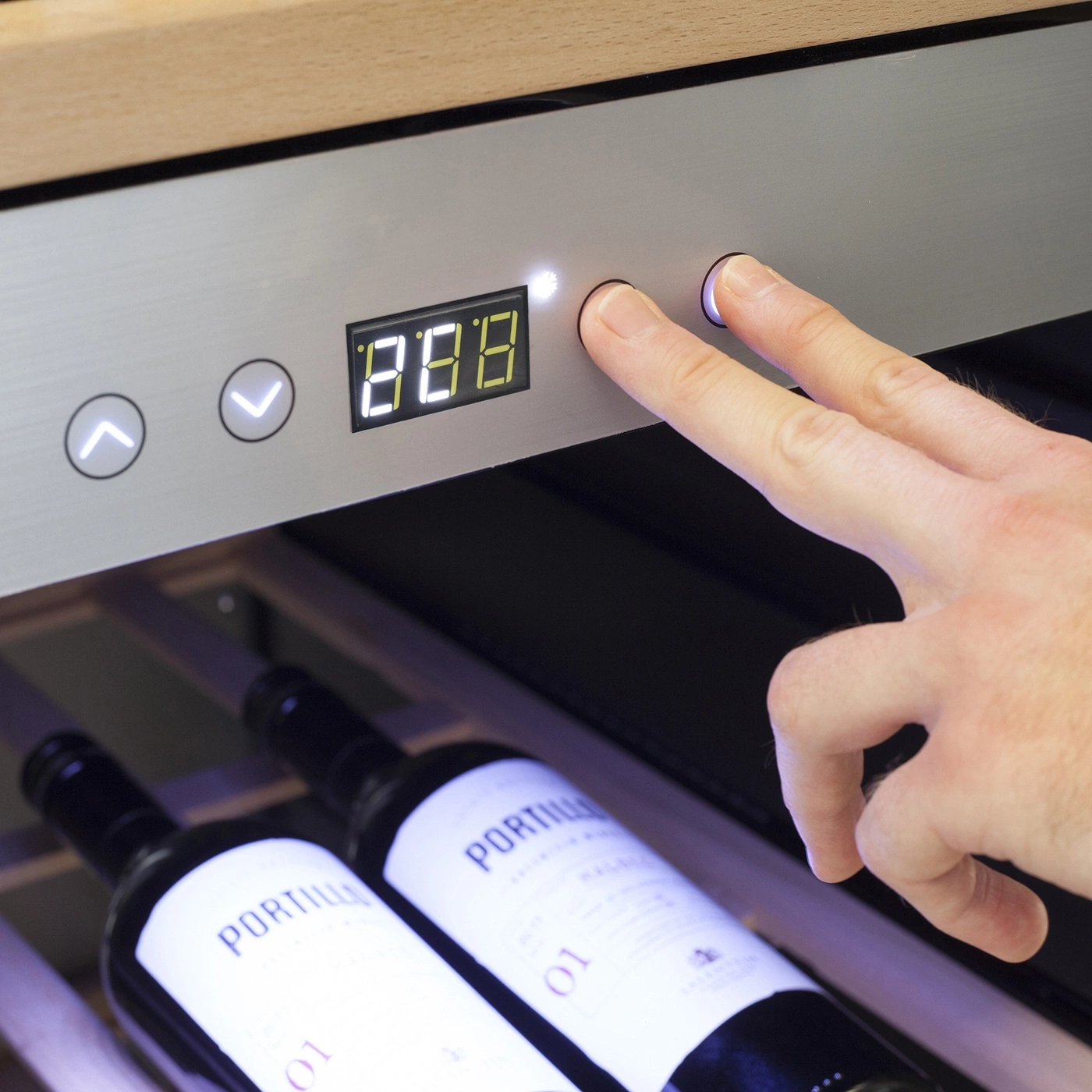 Wine cooler with temperature display and operation by finger press