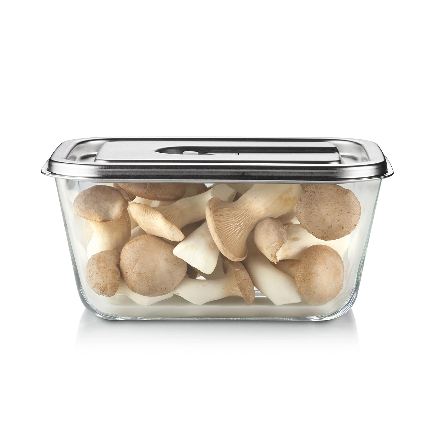 Glass container with mushrooms. Fresh mushrooms inside a transparent container with a lid.