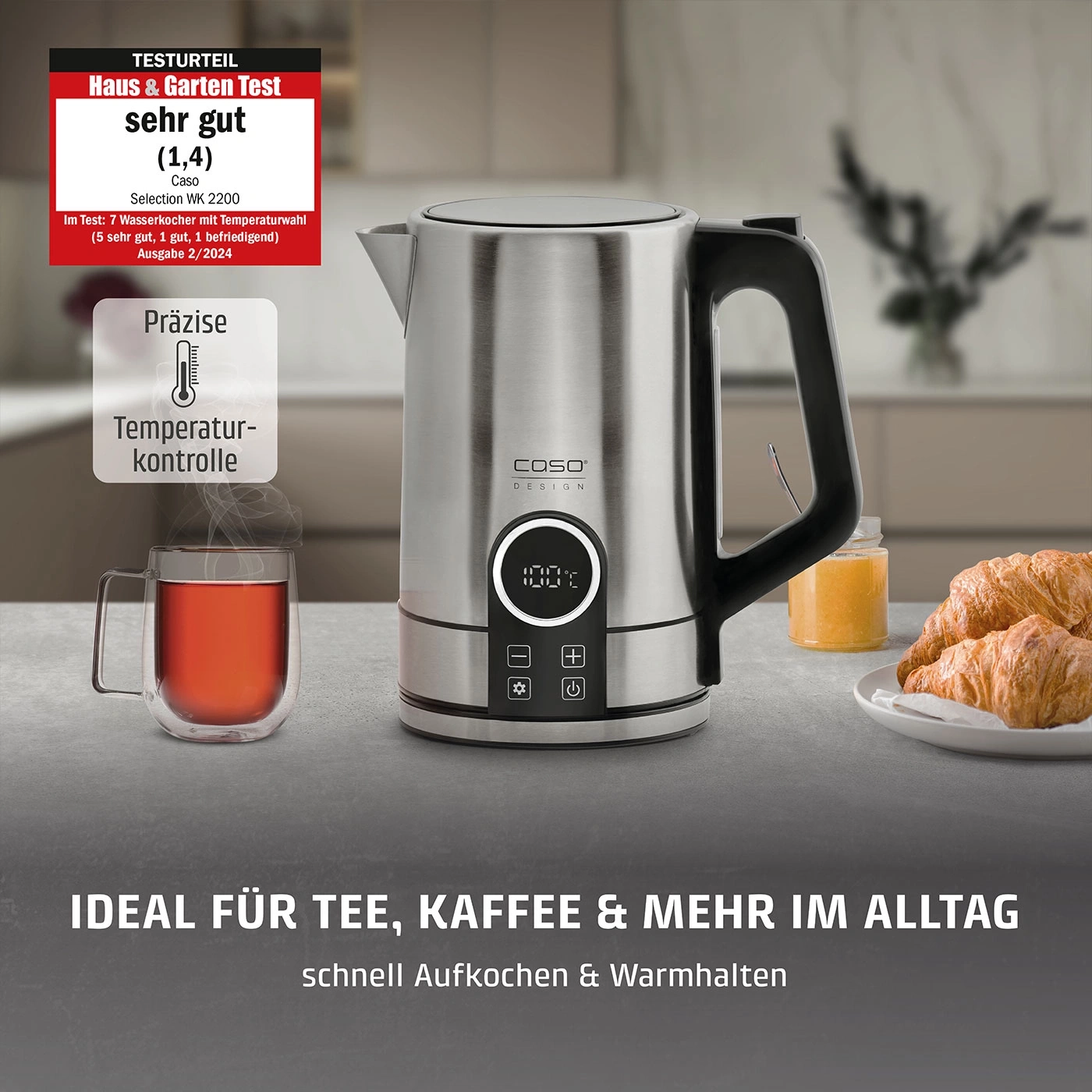Ein Wasserkessel mit Temperaturwahl und einer Tasse Tee.