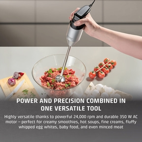 Hand blender in action, preparing minced meat, versatile, power and precision, kitchen appliance.