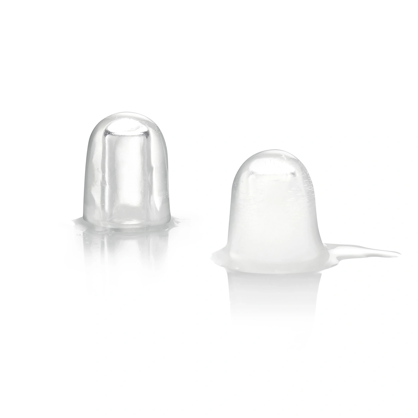 Two cap-shaped ice cubes on a white background.