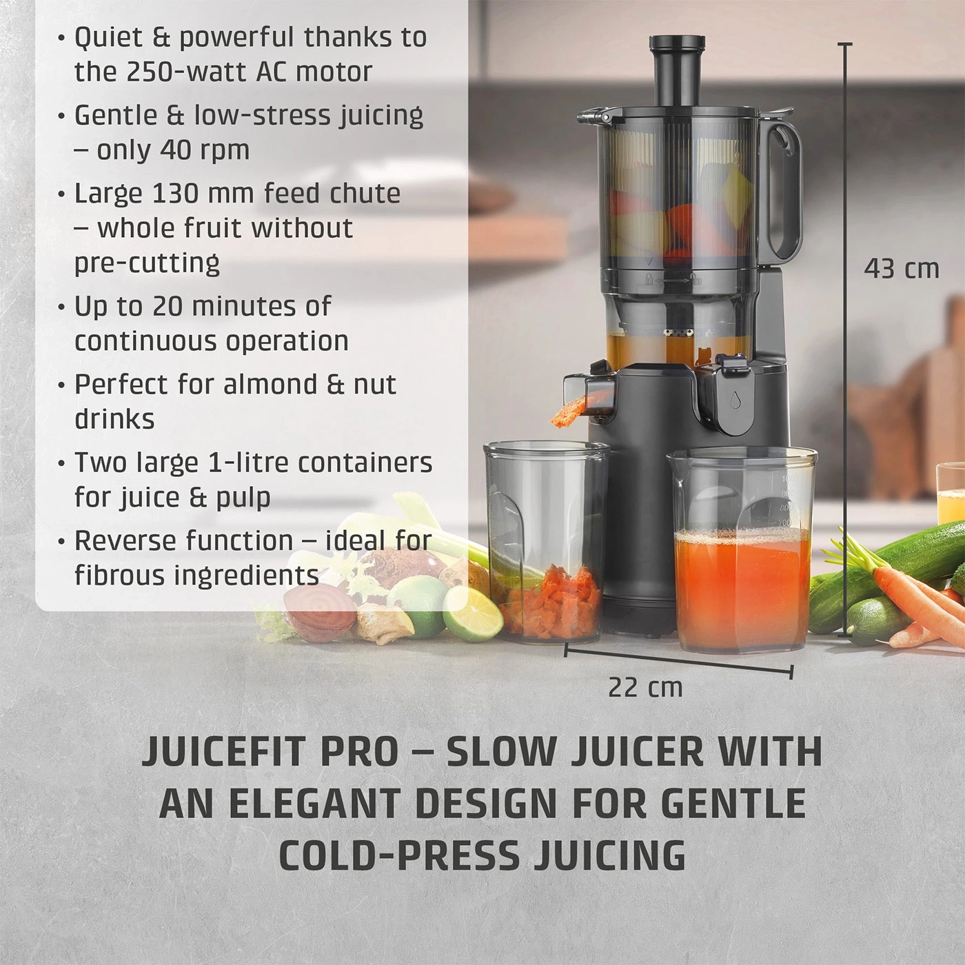 A slow juicer with juice container and fruit, measuring 43 cm high and 22 cm wide.