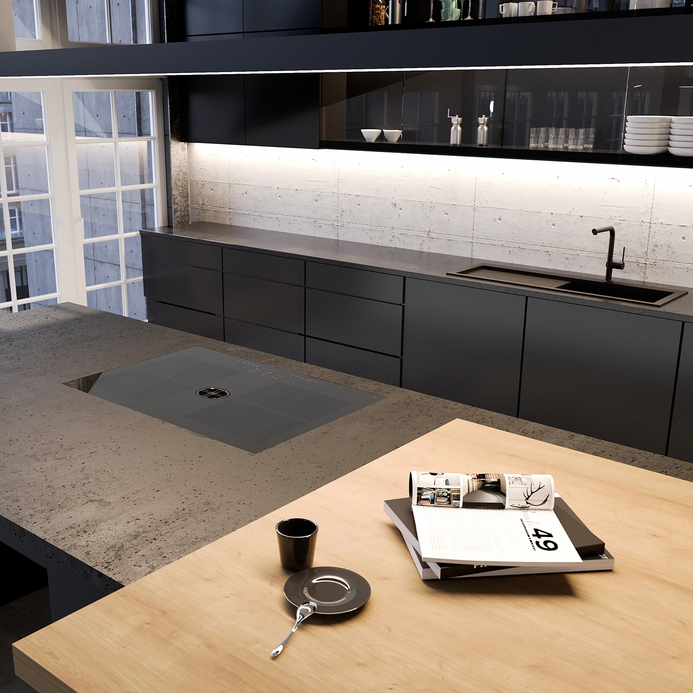 Modern kitchen with concrete walls, black sink, and induction cooktop.