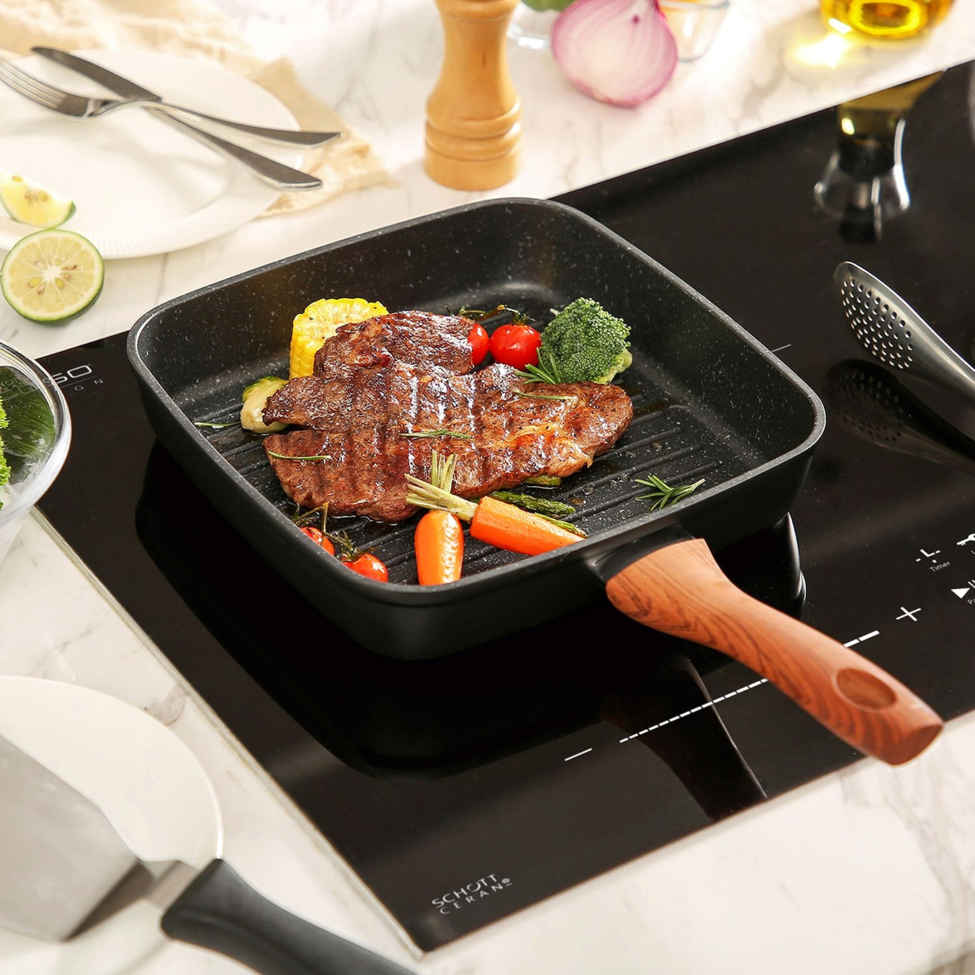 Grilled steak with vegetables in a pan on a stove top, ready to eat.