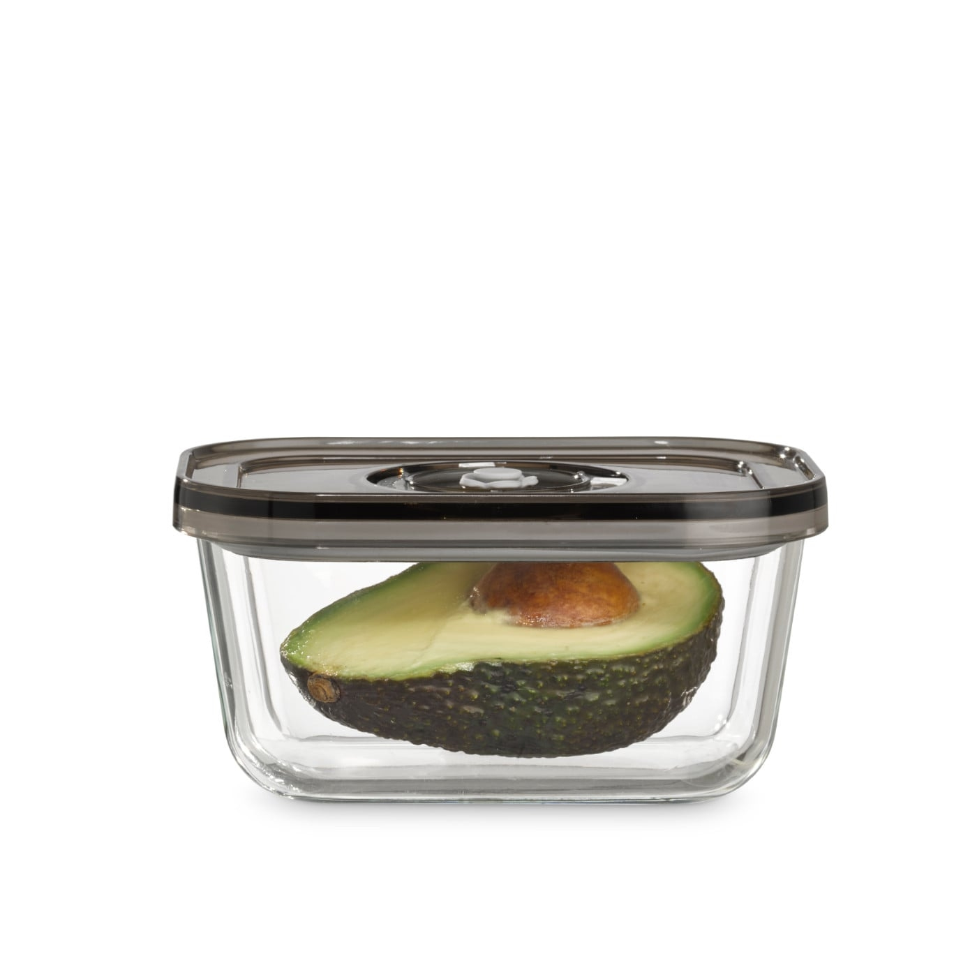 Avocado in a glass container with lid, isolated on white background