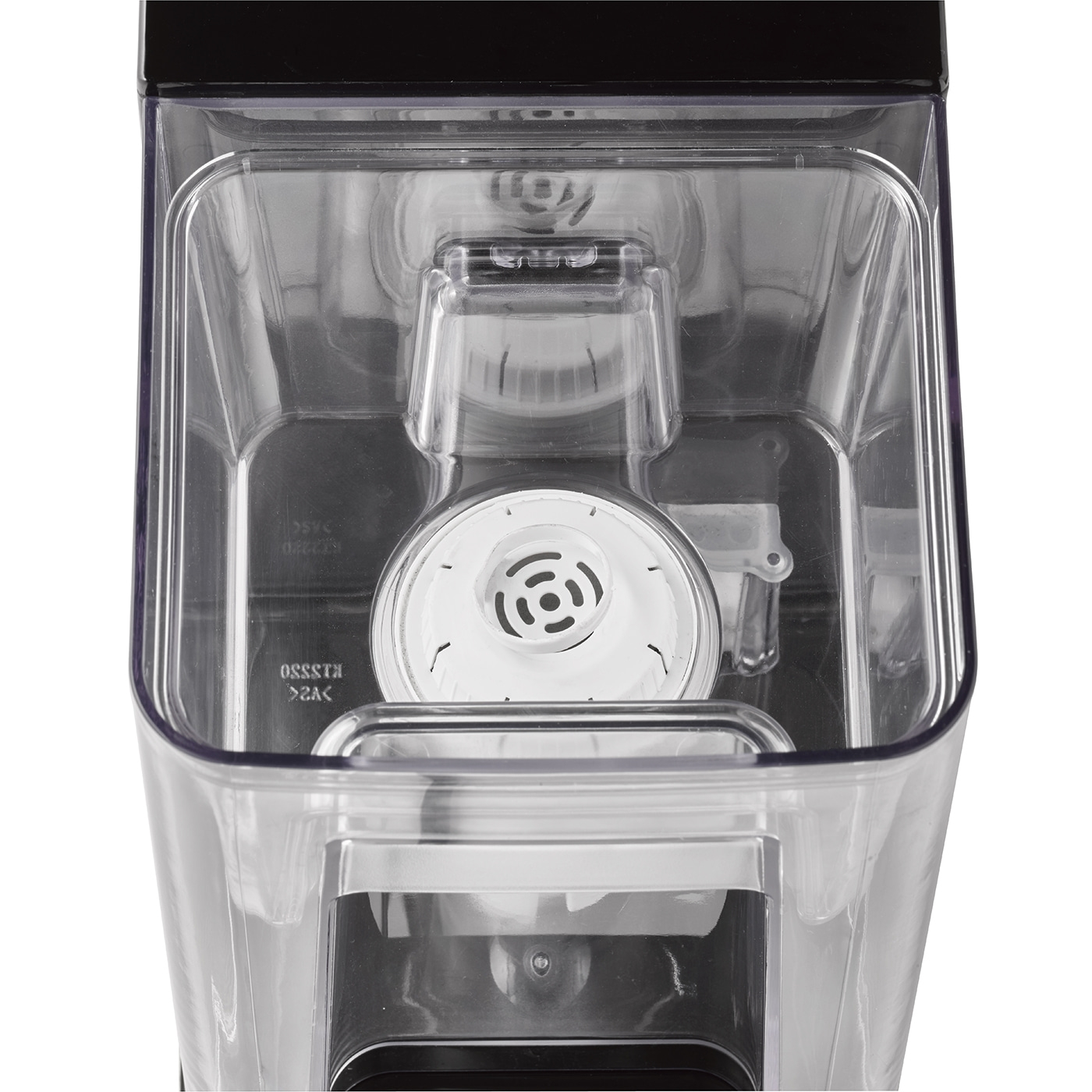 Close-up of a transparent container with white filter and black lid