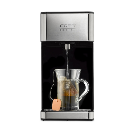 Tea machine with glass cup and tea bag, water flows into the cup