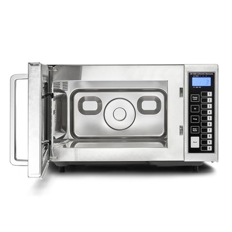 Microwave with open door and control panel with numbers and buttons for operation.