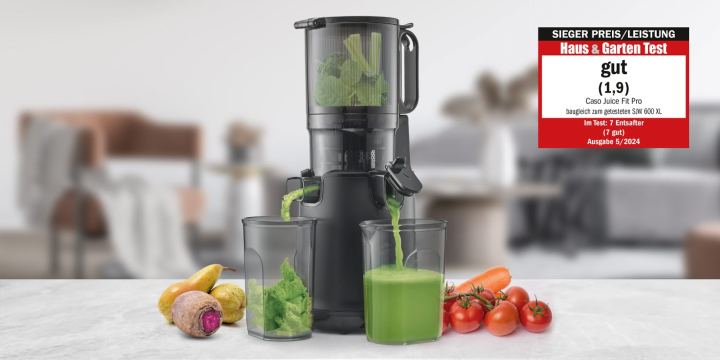 Juicer with vegetables and fruits, rated 'good' by Haus & Garten Test.