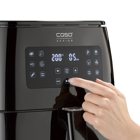 Black air fryer with control panel, hand pressing start button, temperature display, time