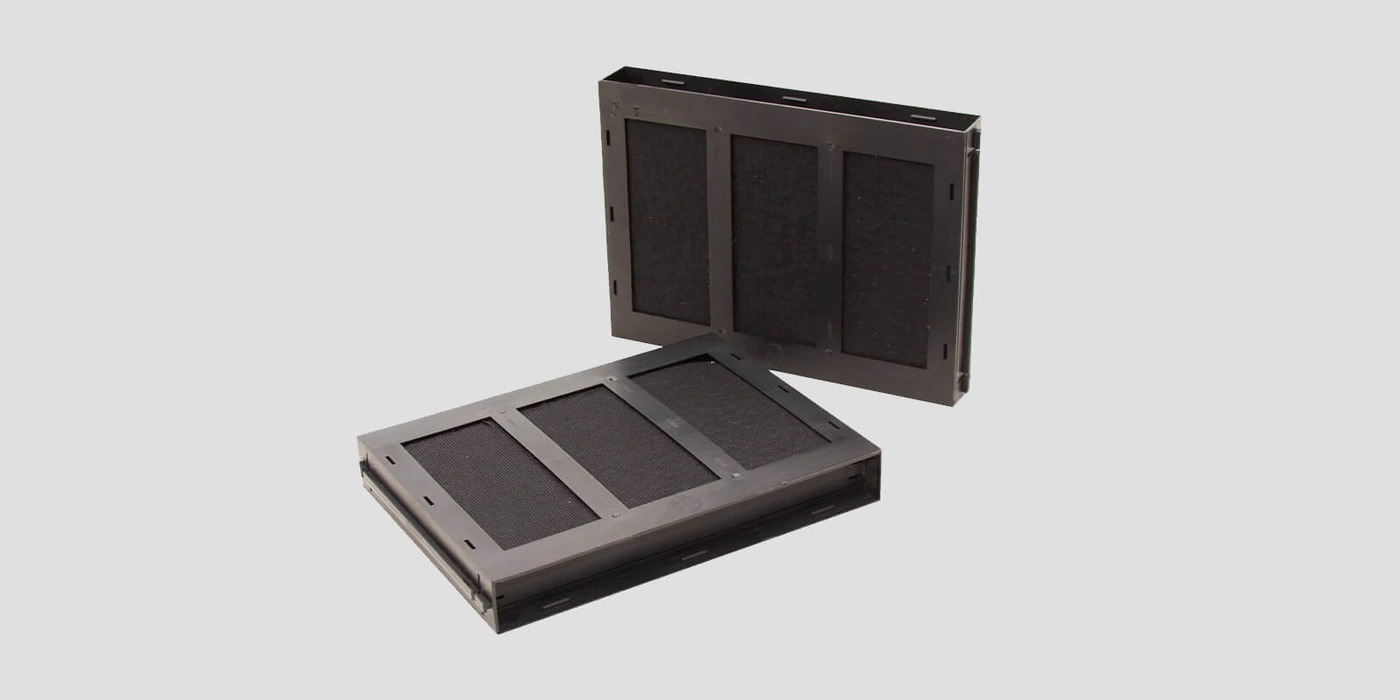 Two black filter elements with three filter inserts each side by side.