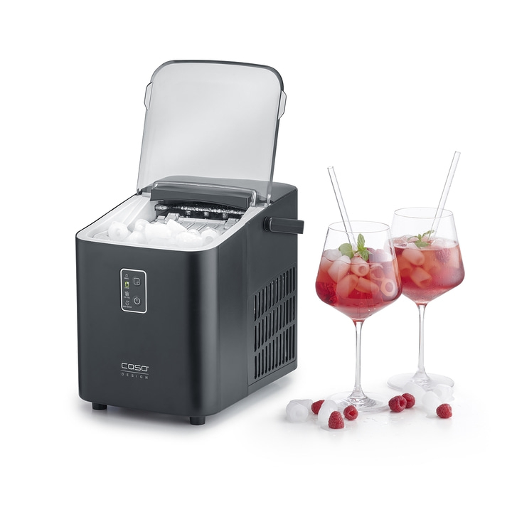 Ice maker with drinks and raspberries on a white background