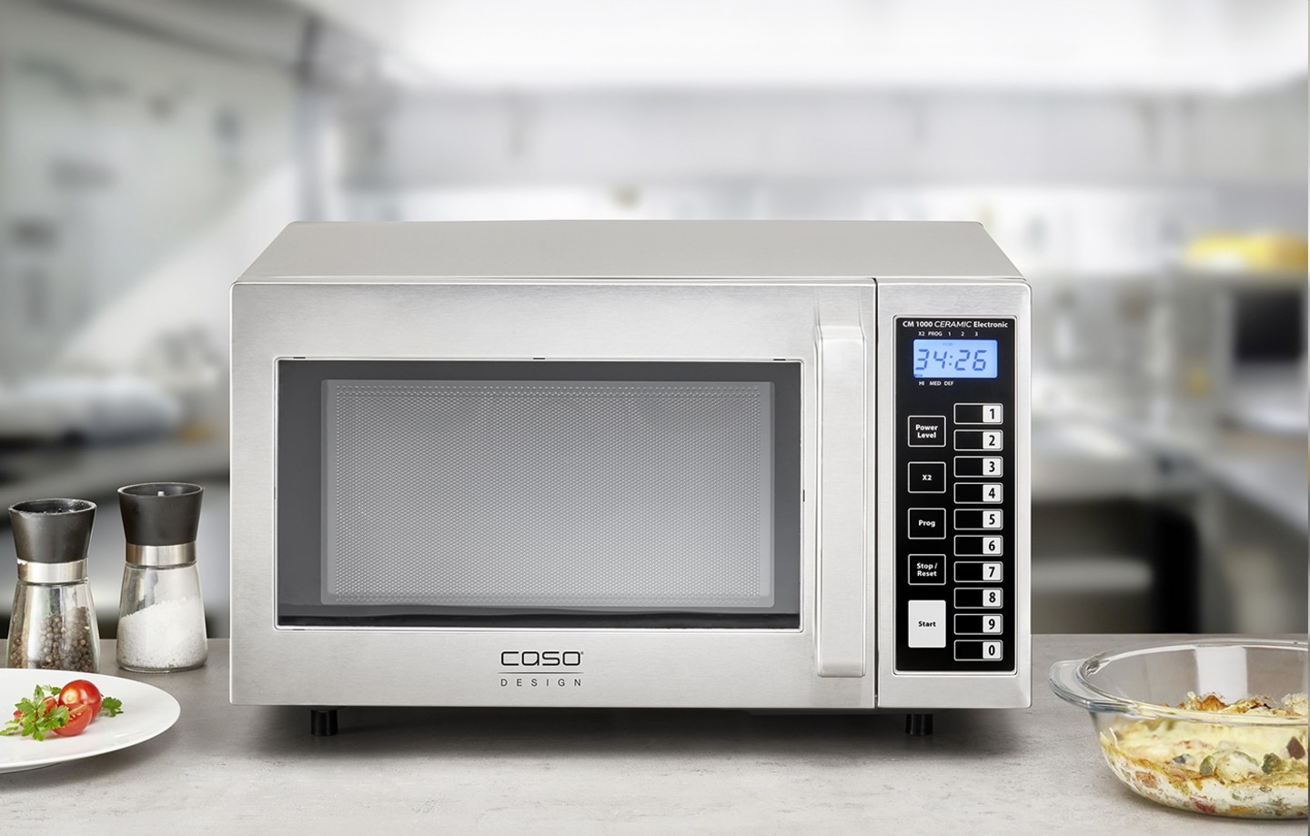 Microwave with digital display, stainless steel design, kitchen background, Caso Design.