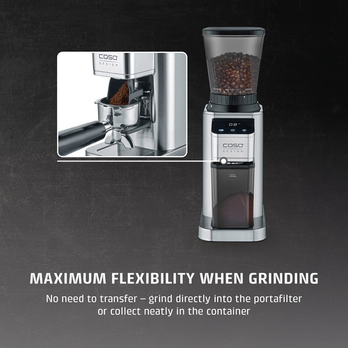 A stainless steel coffee grinder with grounds in the portafilter and container.