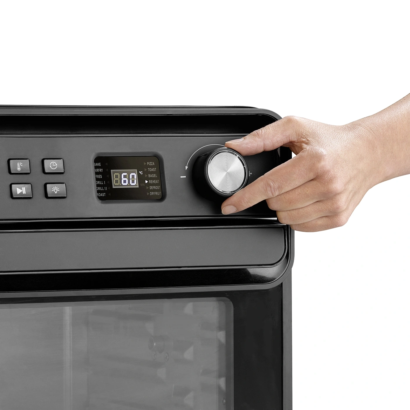 Person turning oven knob set to 860 degrees Celsius, with various cooking options.