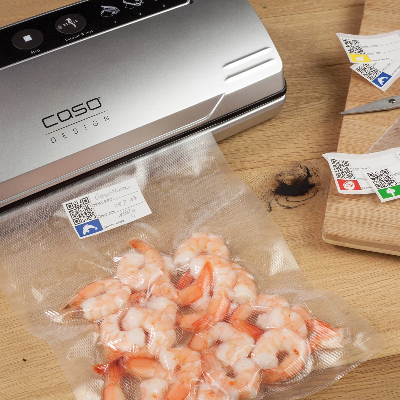 Vacuum sealer with shrimp in bag, label with content, date and weight.