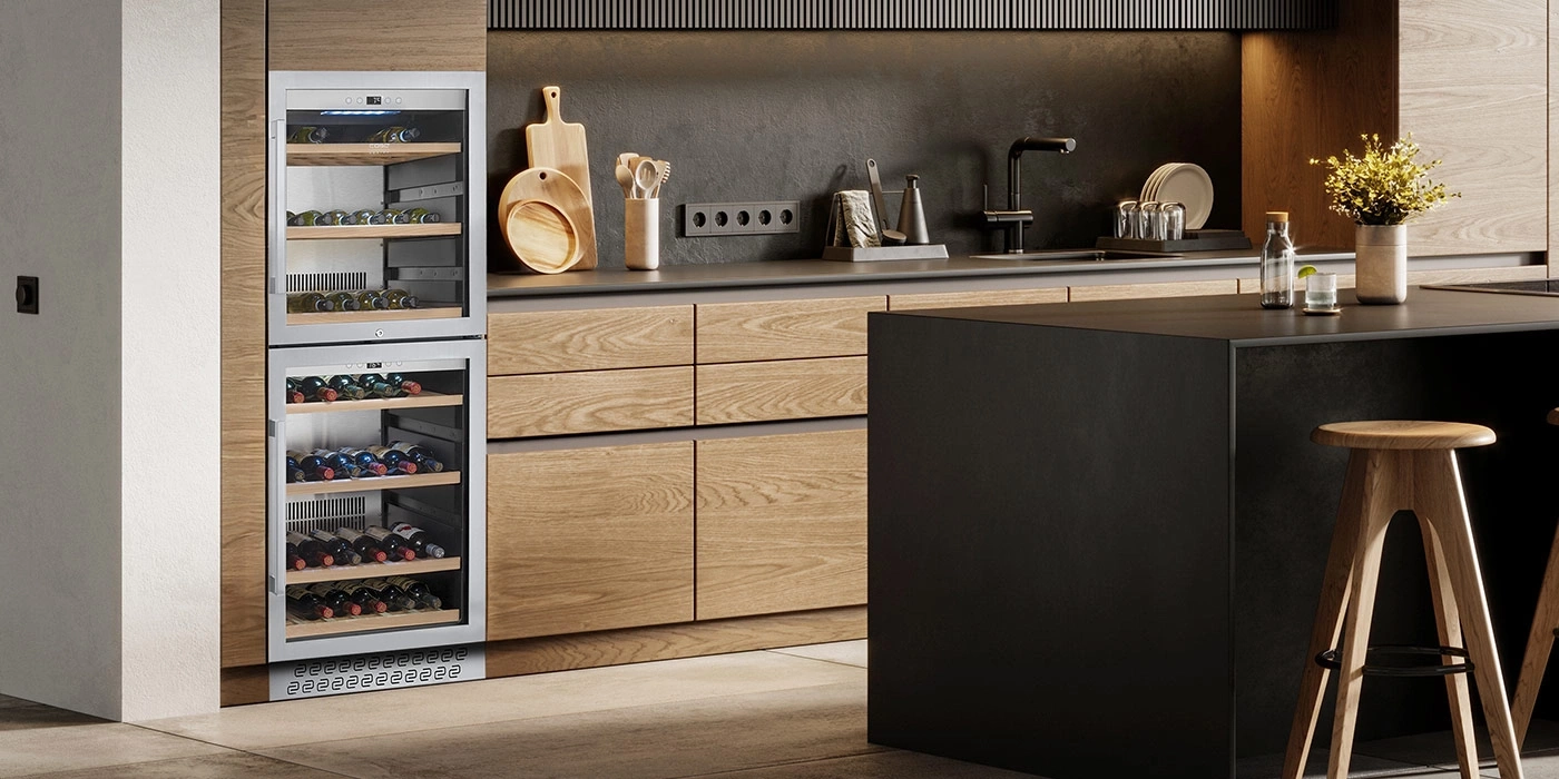 A modern kitchen area featuring wine coolers, wood elements, and a kitchen island.