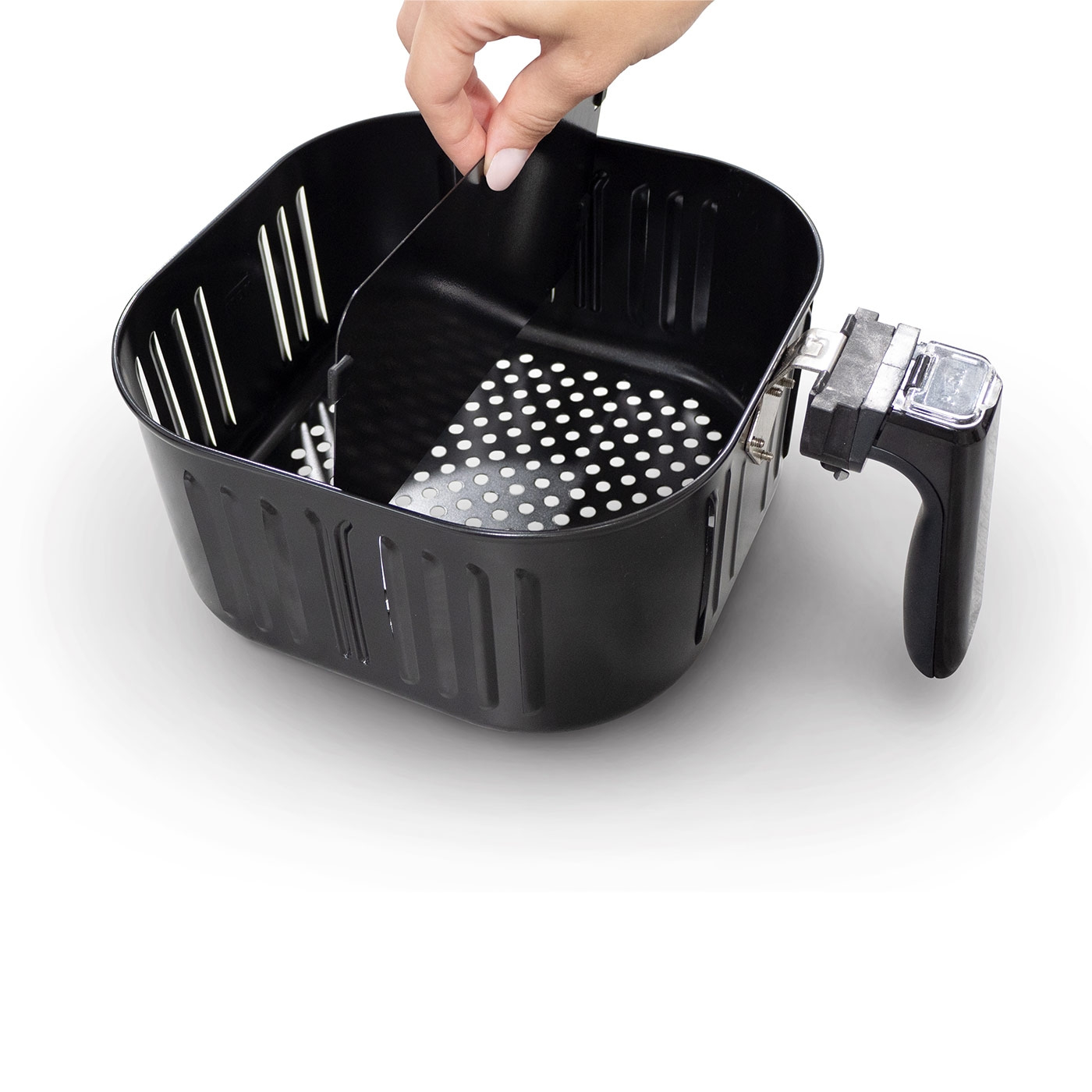 Black air fryer with removable basket, hand holding part of it