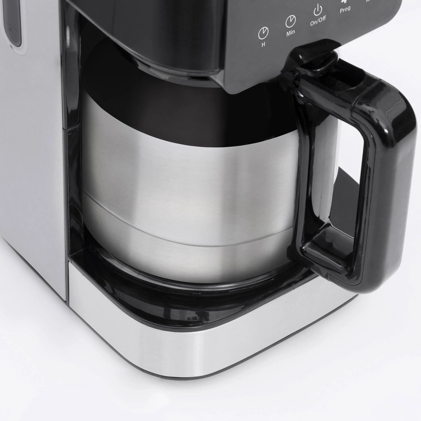 Close-up of a coffee maker with stainless steel and black elements, buttons, and handle.