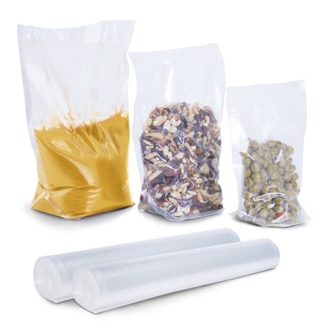 Three food bags and two rolls of vacuum sealer bags on white background.