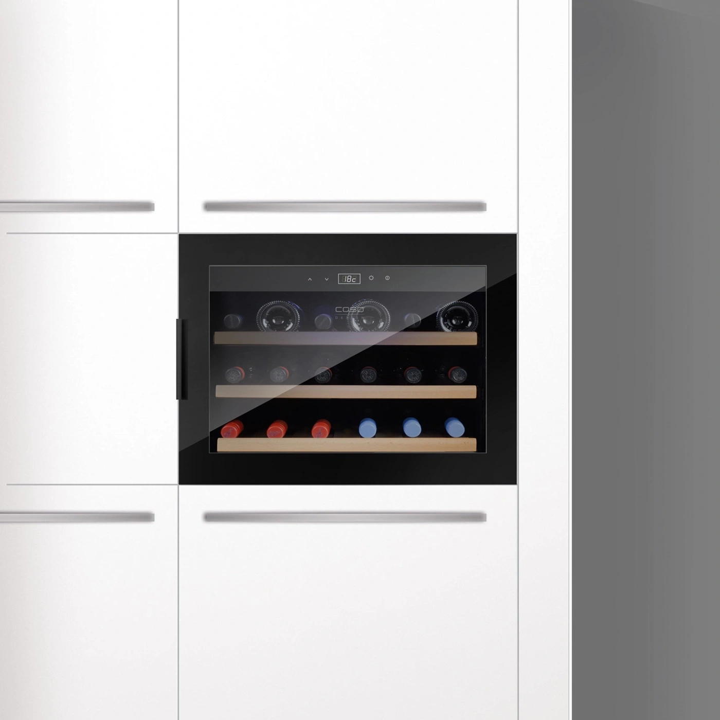 Wine cooler in white kitchen with wine bottles and temperature display